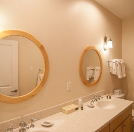 Bathroom with sink, mirrors and ice lights in a hotel in Ogunquit, Maine
