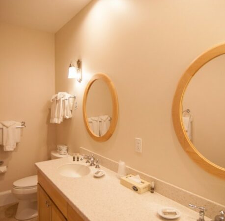 Bathroom with sink, mirrors and ice lights in a hotel in Ogunquit, Maine