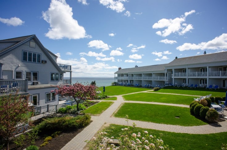 View from the terrace of a hotel room to the greenery and the ocean