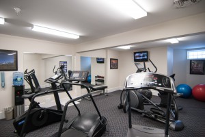 A photo of our fitness room with treadmill and exercise bike