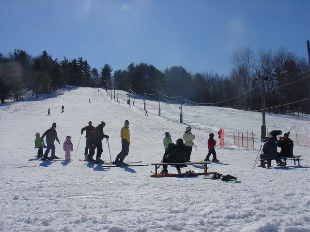 Photo of a Family on a Ski Hill During a Much-Needed Maine Family Vacation.