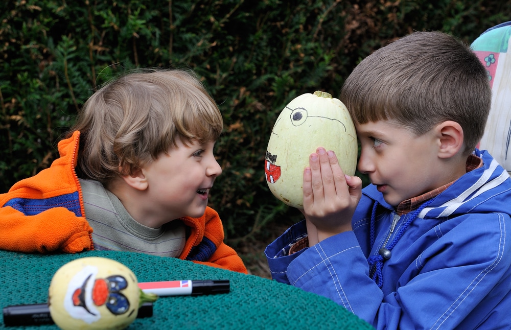 Photo of Two Kids Painting Pumpkins at Ogunquitfest.