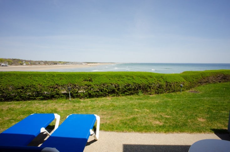 Sunbeds for tourists to rest on the greenery overlooking the ocean