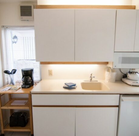 Kitchen with microwave and coffee machine in a hotel room