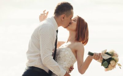 A man and woman kissing at a Maine Wedding Venues.